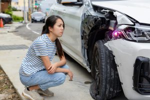 Woman encounter car accident on the road